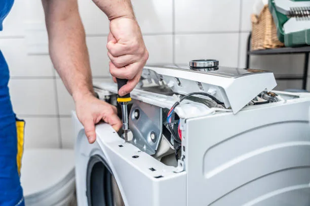 Technician opening the top control panel of a washing machine